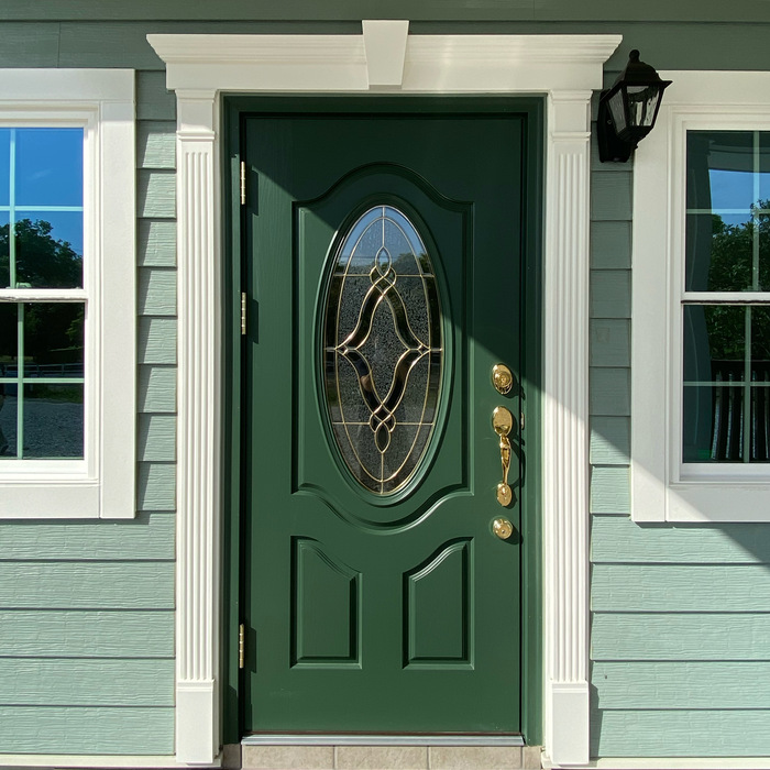 かわいいグリーンの玄関ドア